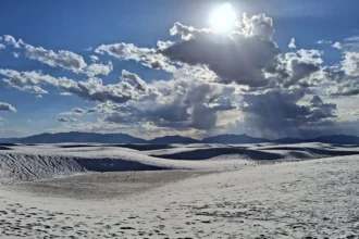 White gypsum dunes at White Sands in New Mexico under a wide sky