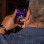 People using mobile phones outdoors