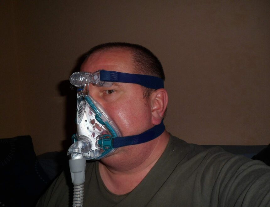 A person sleeping peacefully at home in bed