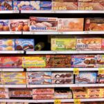 Shelves of packaged foods in a supermarket aisle
