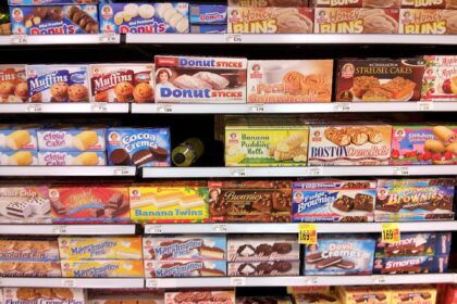 Shelves of packaged foods in a supermarket aisle