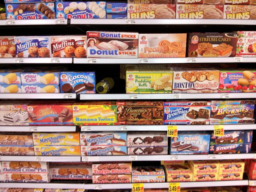 Shelves of packaged foods in a supermarket aisle